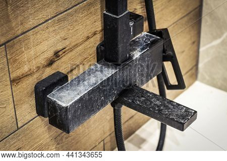 Black Faucet With Limes Cale Deposits Due To Water Hardness