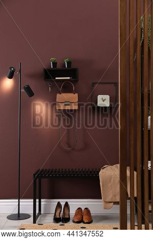 Modern Hallway Interior With Stylish Furniture And Key Holder