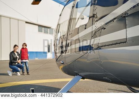 Beautiful Mother And Her Child Admiring A Cool Plane
