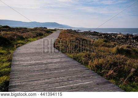 Wooden walkways on the ocean coast of Galicia, Spain.