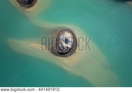 Drone View Of The Turquoise Lake Formed As A Result Of Mining Waste