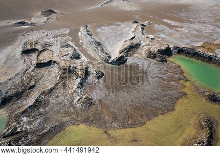Drone View Of The Turquoise Lake Formed As A Result Of Mining Waste