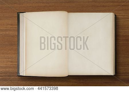 Open old book, antique off white pages with design space
