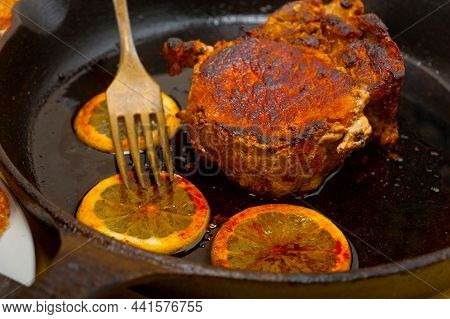 Pork Chop Seared On Iron Skillet
