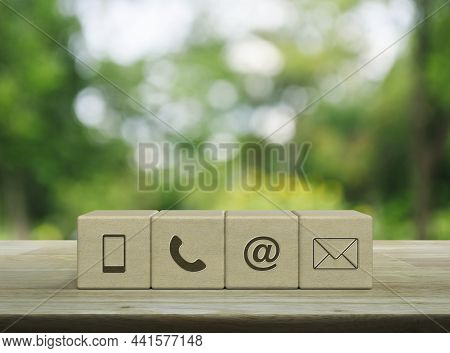 Mobile Phone, Telephone, Email Address, Mail Icon On Wood Block Cubes On Wooden Table Over Blur Gree