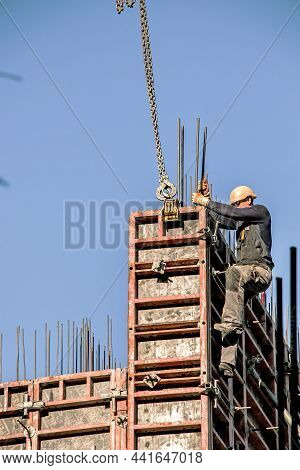 Workers Are Assembling Metal Formwork During The Construction Of A Residential Building.