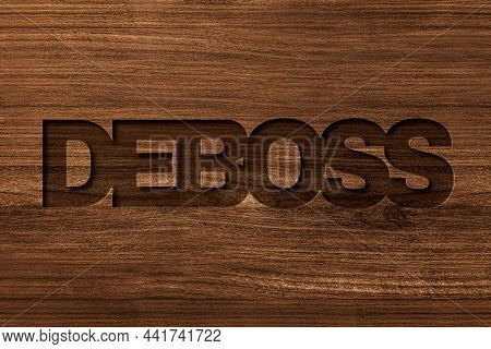 Deboss typography in engraved wood font