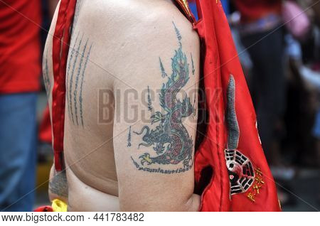 Jakarta, Indonesia - Februari 21, 2016 : A Dragon Tattoo On The Upper Arm Of A Monk At The Cap Go Me