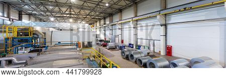 Production Line Of Metal Tile For Roof. Steel Forming Machine In Metalwork Factory Workshop. Metal S
