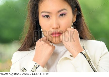 Pretty Asian Woman With White Jacket. Vi