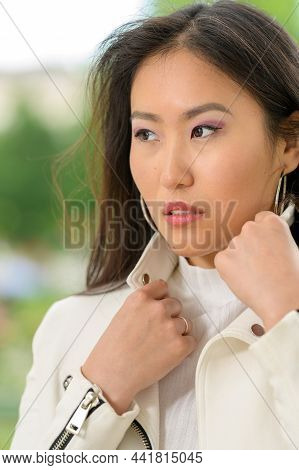 Pretty Asian Woman With White Jacket. V
