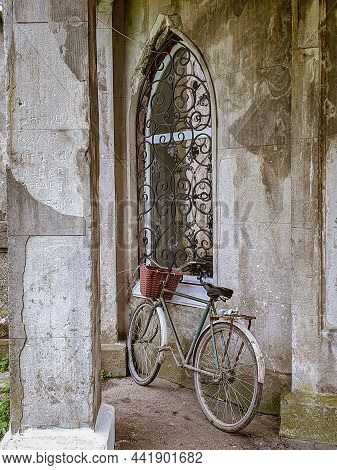 Bicycle Leaning Against An Ancient Wall. High Quality Photo
