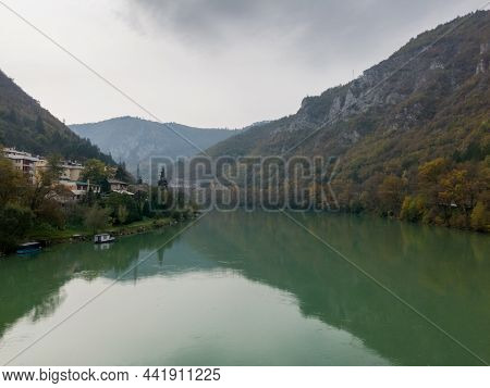 The River Drina Flows Between The High Mountains Near The Town Of Visegrad