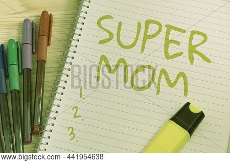 Hand Writing Sign Super Mom. Business Showcase A Mother Who Can Combine Childcare And Fulltime Emplo