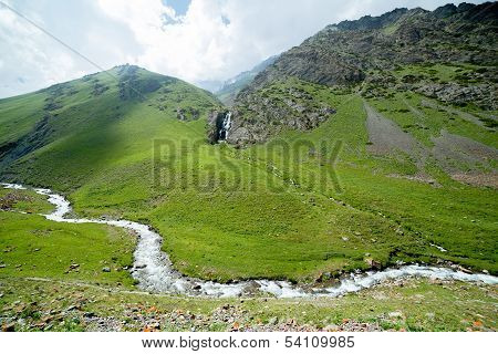 Waterfall and river in Tien Shan, Kyrgyzstan