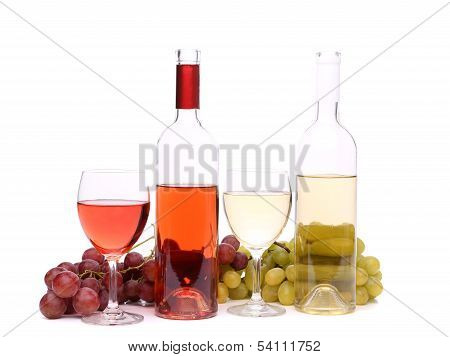 Two glass, two bottles of wine and grapes