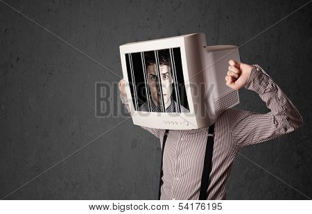 Business man with monitor screen on his head traped into a digital system concept