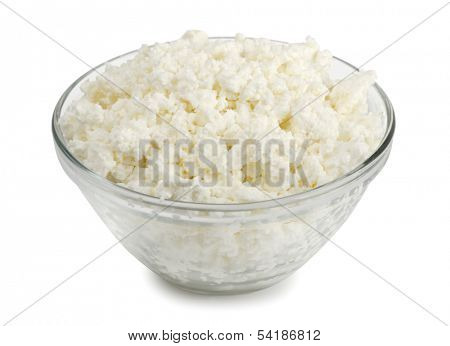 Glass bowl of fresh cottage cheese isolated on white