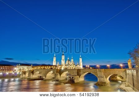 Stone Bridge Across The Ebro River At Zaragoza, Spain