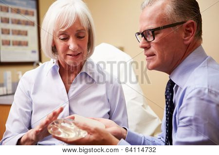 Woman Discussing Breast Augmentation With Plastic Surgeon
