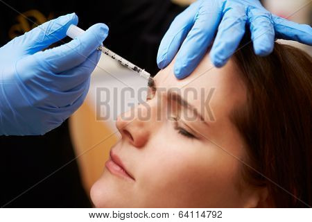 Woman Having Botox Treatment At Beauty Clinic