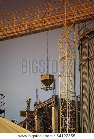 Building Construction Worker Working On Construction Site With Heavy Tool And Building Constructure