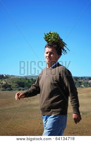 Man with aspargus bundle, Spain.