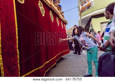 Girl Tries To Touch The Skirt Of The Throne To Have Good Luck, Popular Tradition In Andalusia, Easte