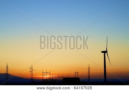 silhouette of a alectrical substation and windmill, La Muela, Zaragoza, Aragon, Spain