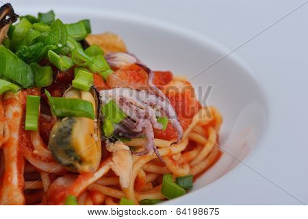 Pasta with shrimps, herbs and mashrooms isolated on white background in studio