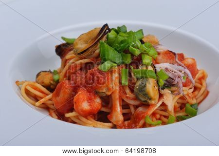 Pasta with shrimps, herbs and mashrooms isolated on white background in studio