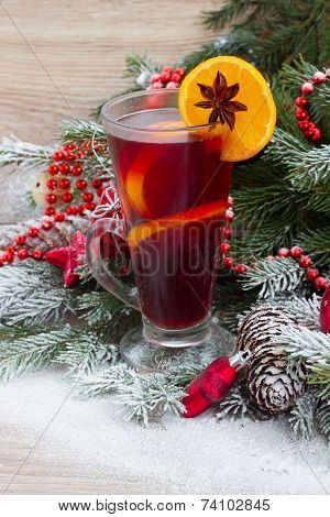 mulled wine with decorated christmas tree