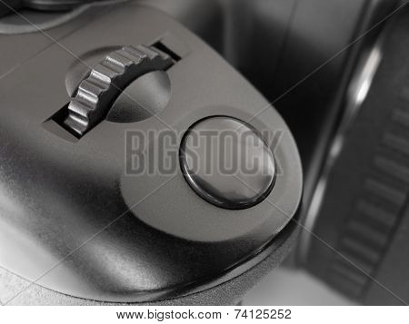 Macro of shutter release button on photo camera - technology background