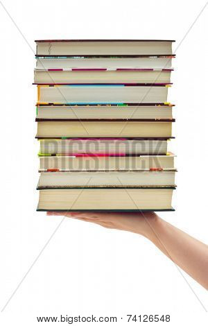 Stack of books in hand isolated on white background