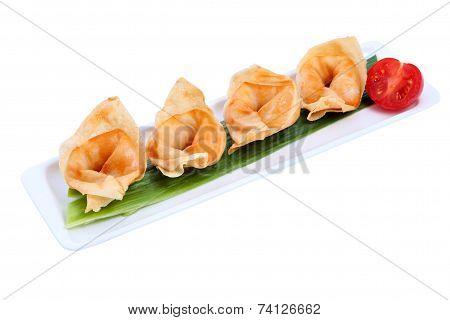 Chinese Dumplings On Plate , In A Row, Over White Background.