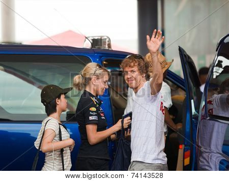 SEPANG, MALAYSIA - APRIL 10: Sebastian Vettel (team Red Bull Racing) greet fans at the autograph session on Formula 1 GP, April 10 2011, Sepang, Malaysia