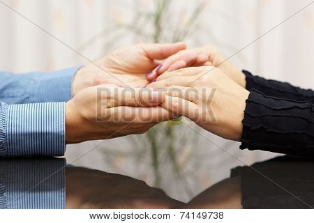 Man  Holding Woman Hands. Love And Care Concept