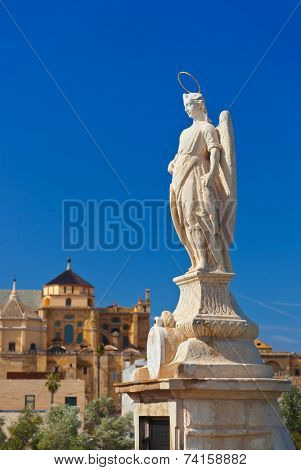 Archangel Raphael statue on bridge at Cordoba Spain - nature and architecture background