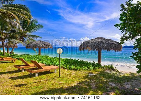 Chairs on tropical beach at Seychelles - vacation background