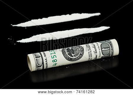 Cocaine and money isolated on black background