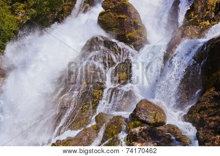 Waterfall near Briksdal glacier - Norway - nature and travel background