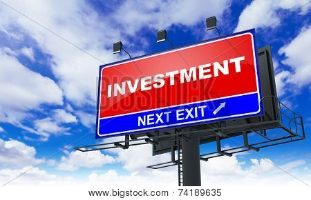Investment Inscription on Red Billboard.