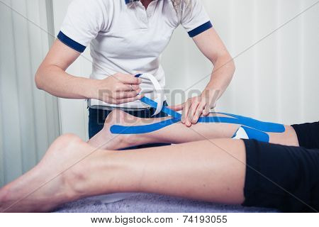Physiotherapist Applying Kinesio Tape