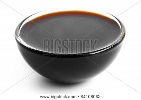 Soja sauce in small glass dish.