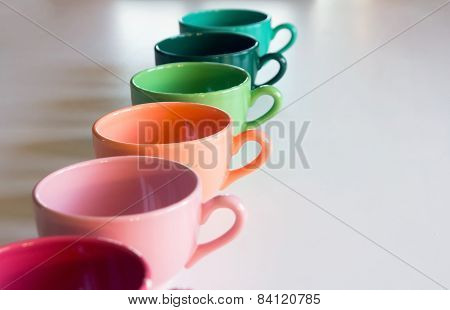 Multicolor Cup's On A Whie Table
