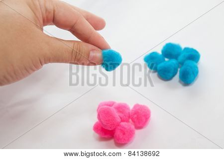 Hand Grabing One Of Blue Set