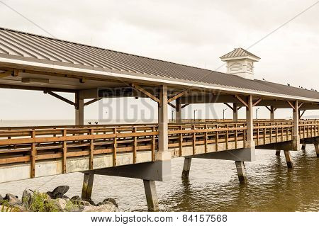 Wood And Cement Pier In Cloudy Sky