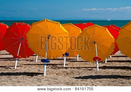 Umbrellas On Sandy Beach