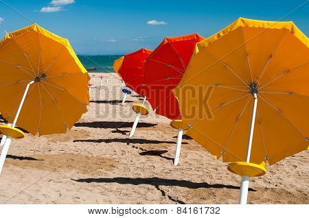 Umbrellas On Sandy Beach