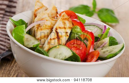Salad With Grilled Chicken In A White Bowl.